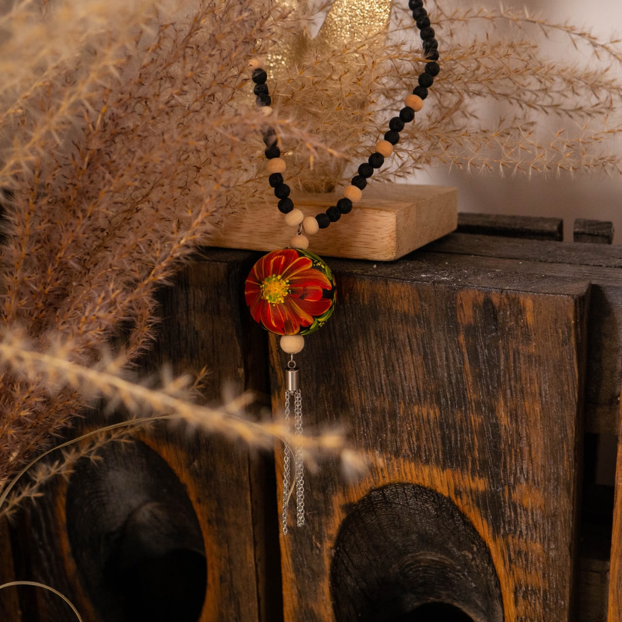Necklace with painted floral motifs