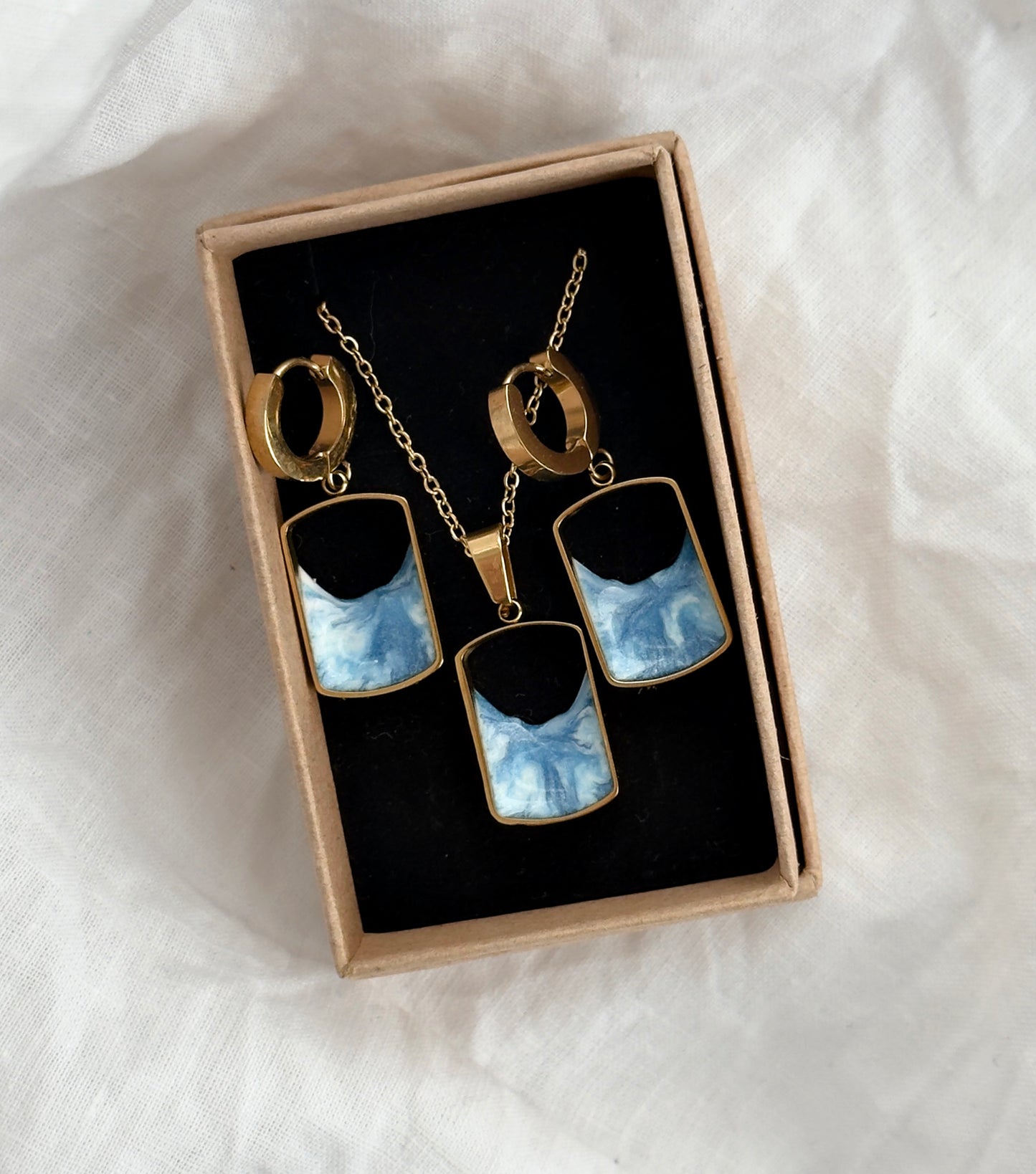 Pendientes y colgante de acero inoxidable con olas