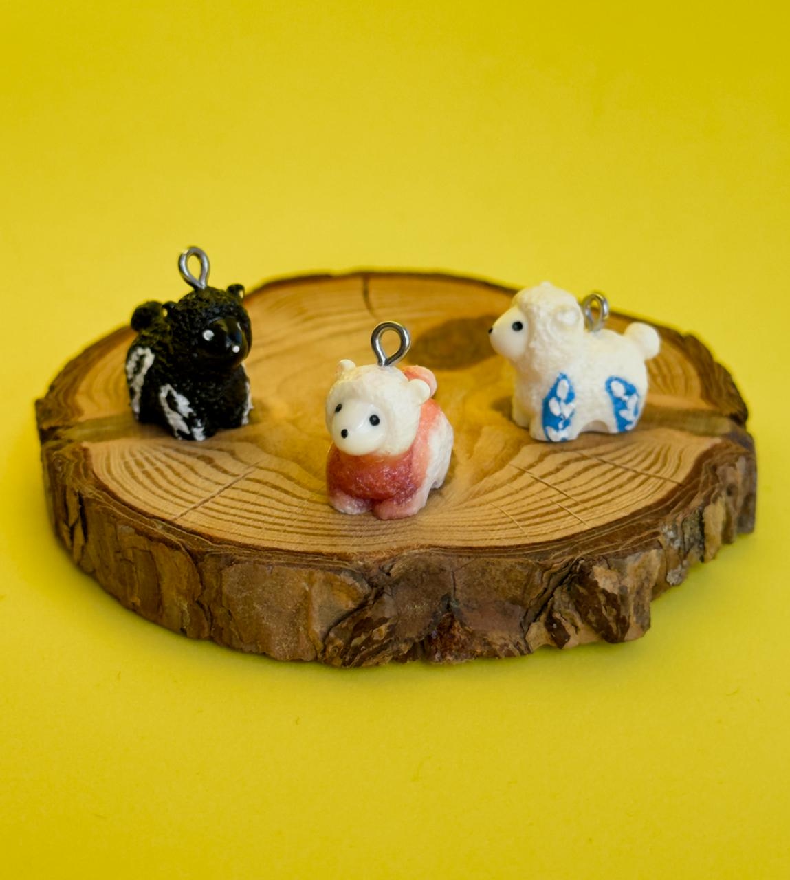 All pendants feature a miniature sheep animal and are hand-painted.
