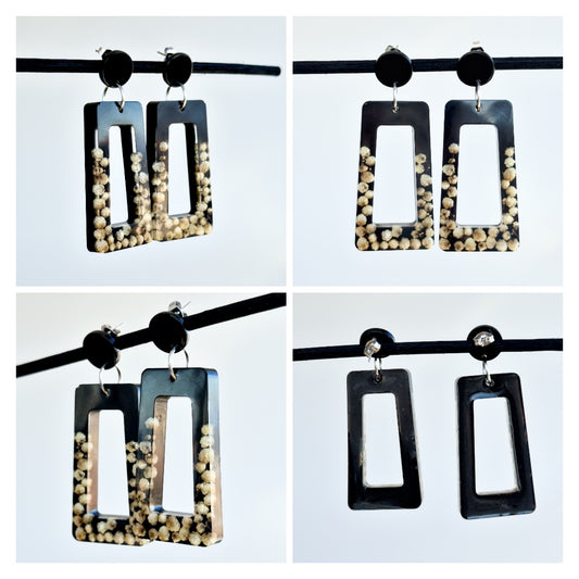 Pendientes negros con flores reales