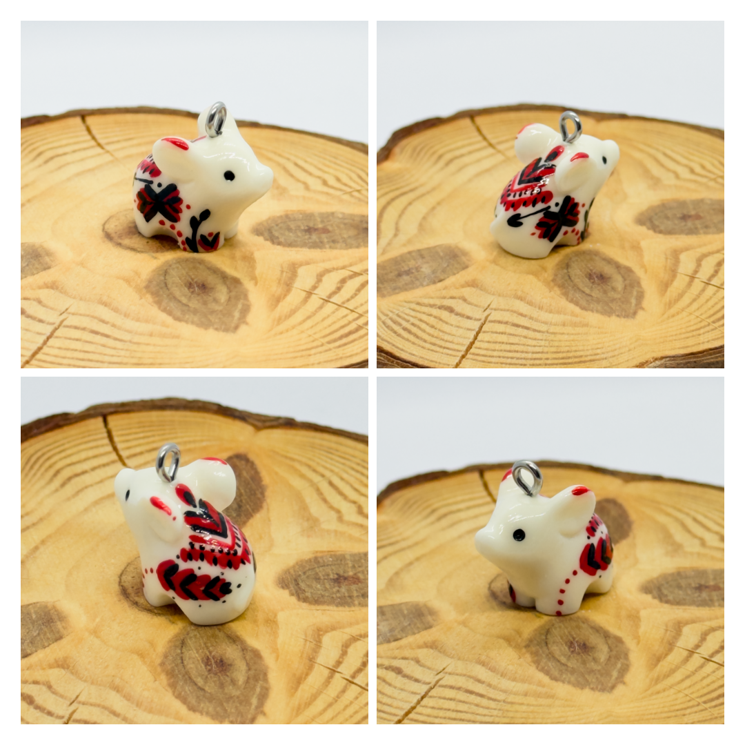 All the pendants feature a miniature piglet animal and are hand-painted.