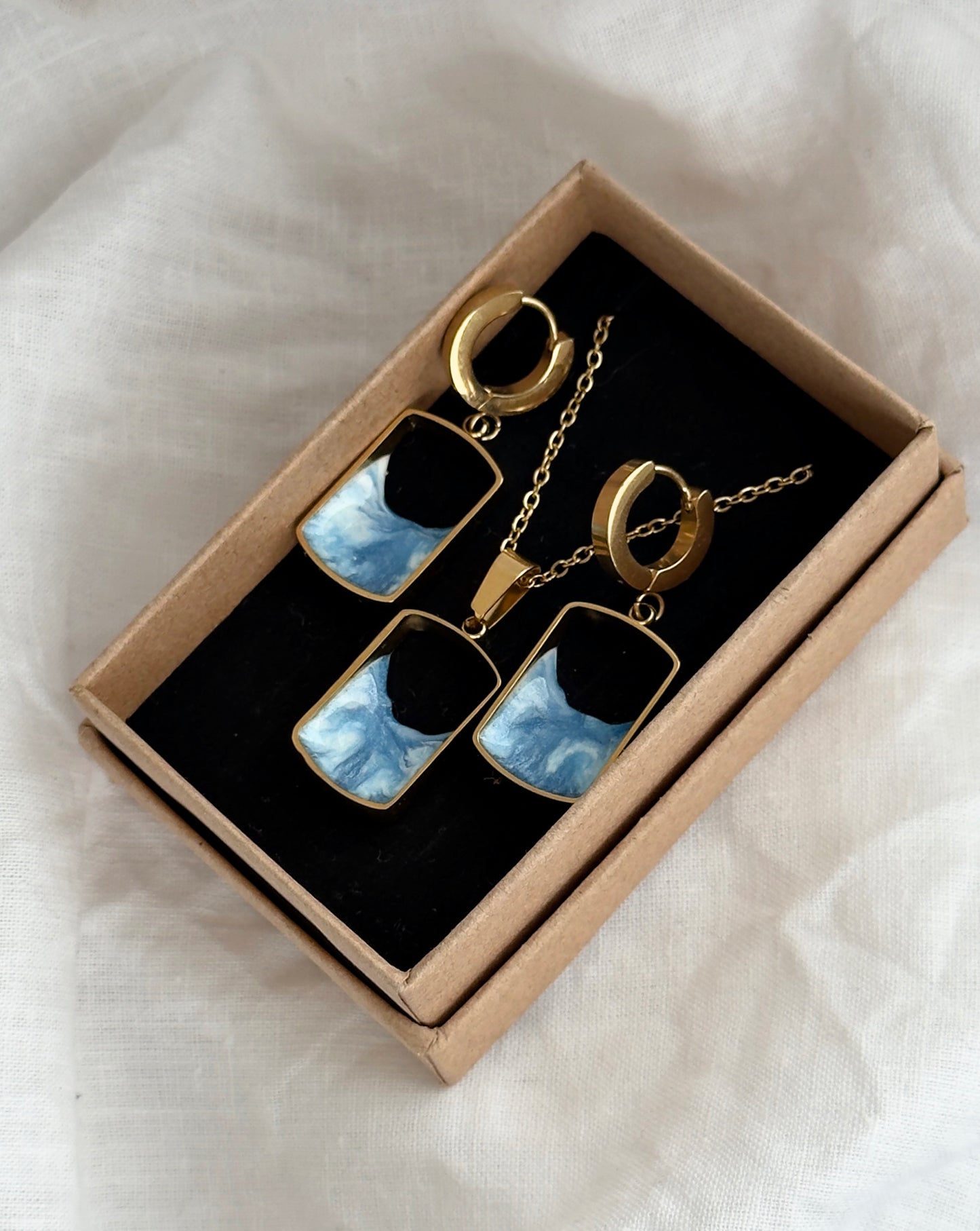 Pendientes y colgante de acero inoxidable con olas
