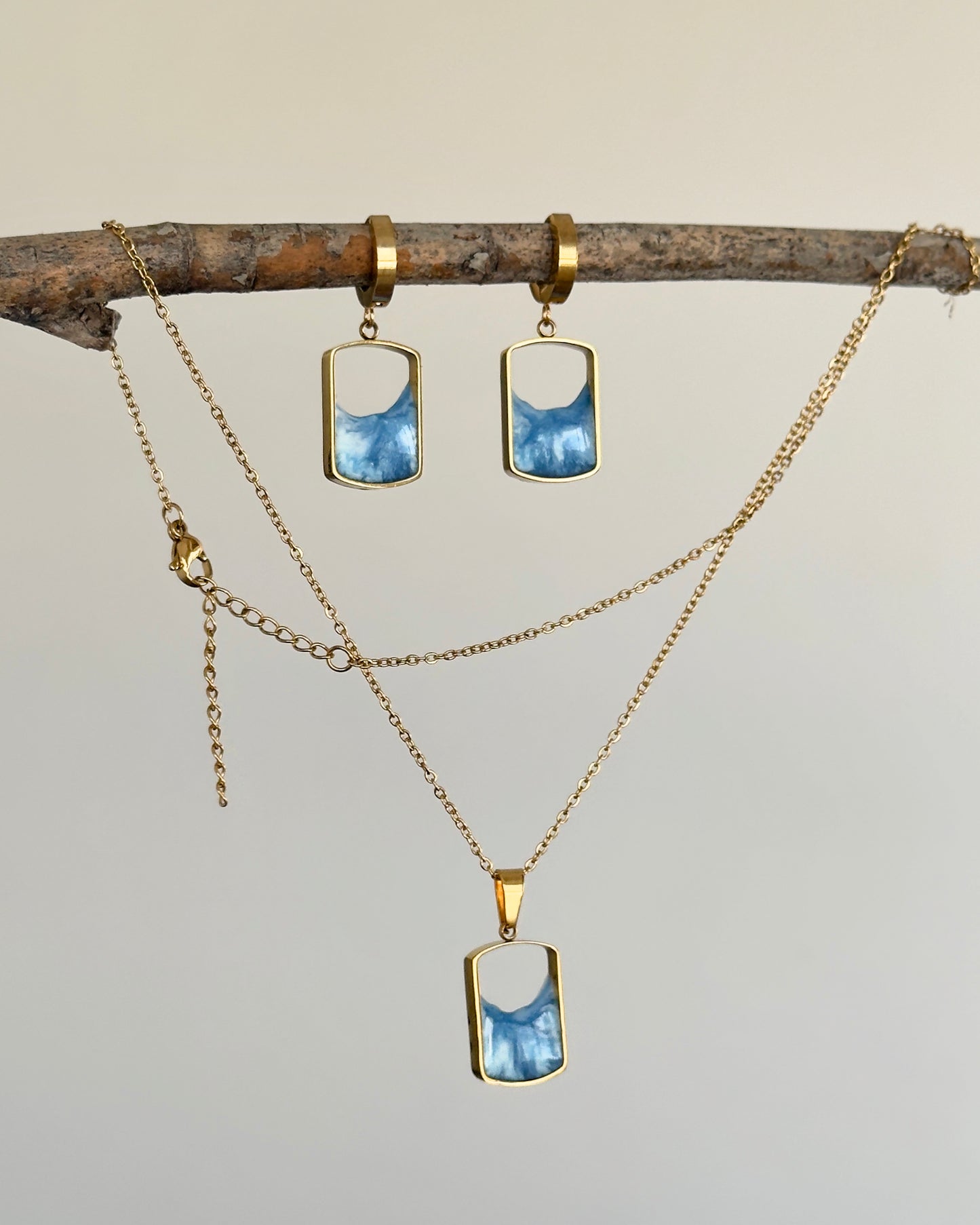 Pendientes y colgante de acero inoxidable con olas