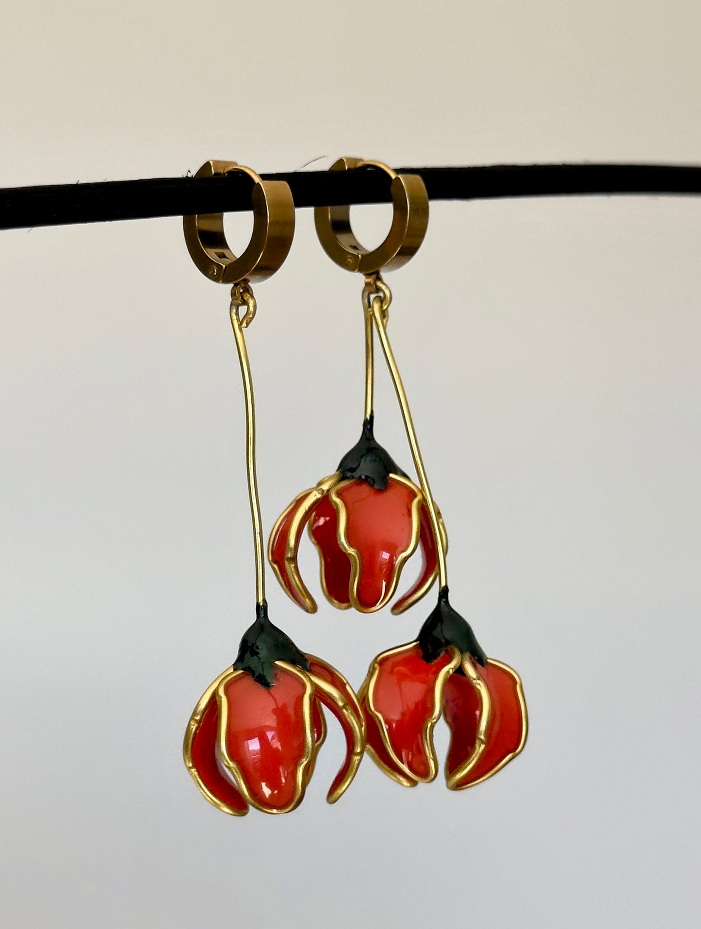 Pendientes con flores naranjas