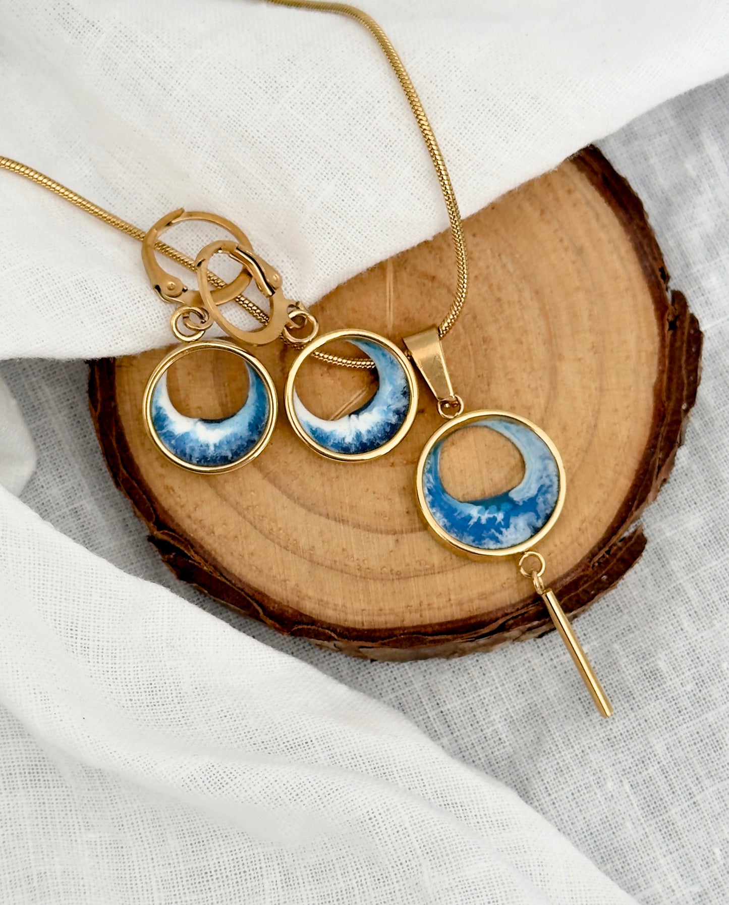 Pendientes y colgante de acero inoxidable con olas