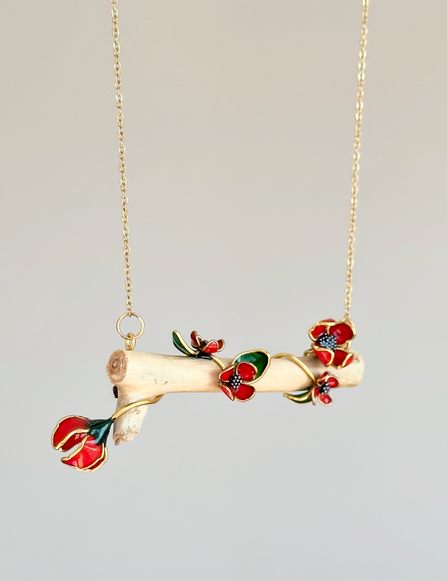 Colgante de ramita con flores