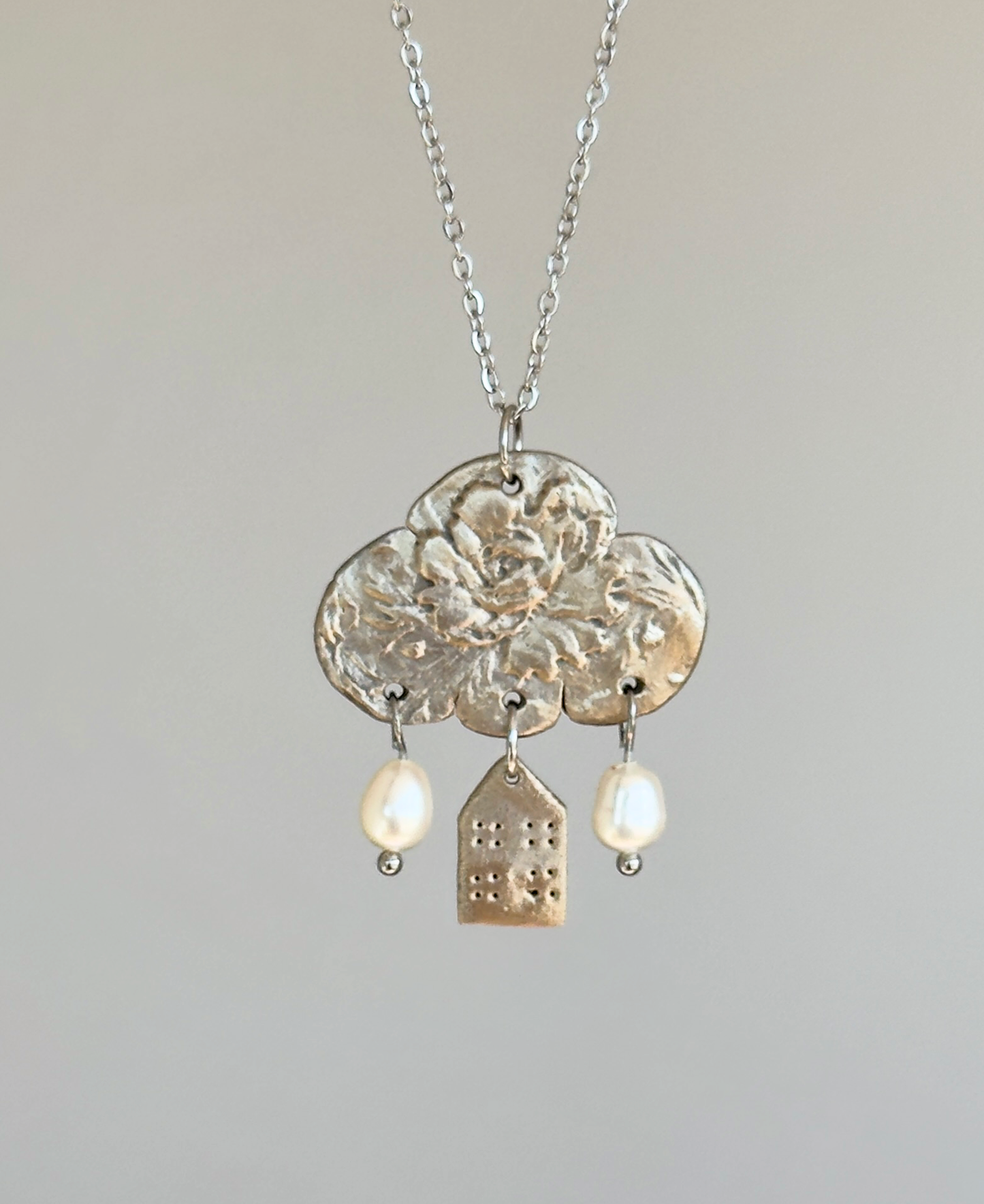Colgante de bronce blanco «Reflexiones sobre el hogar»