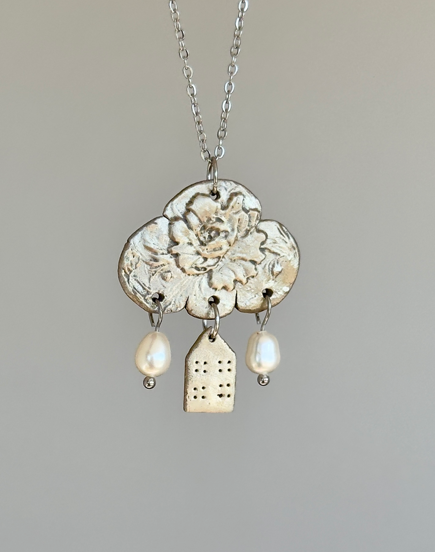 Colgante de bronce blanco «Reflexiones sobre el hogar»