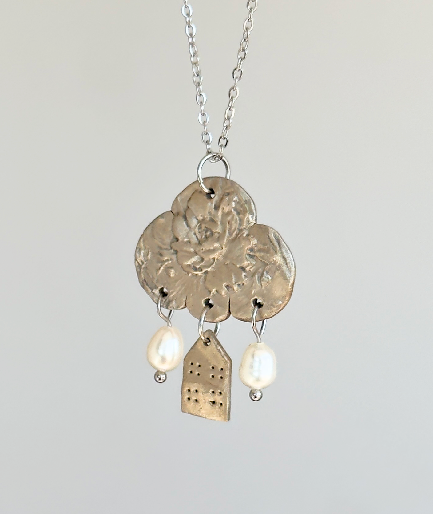 Colgante de bronce blanco «Reflexiones sobre el hogar»