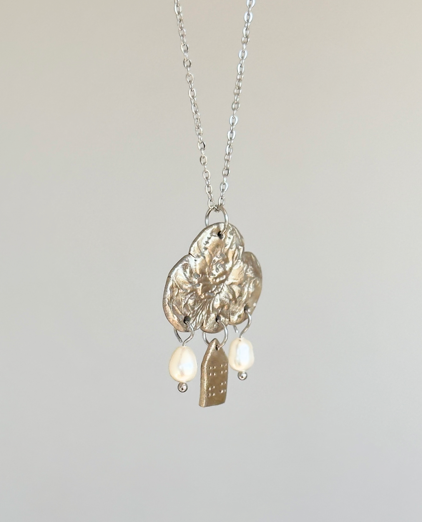 Colgante de bronce blanco «Reflexiones sobre el hogar»