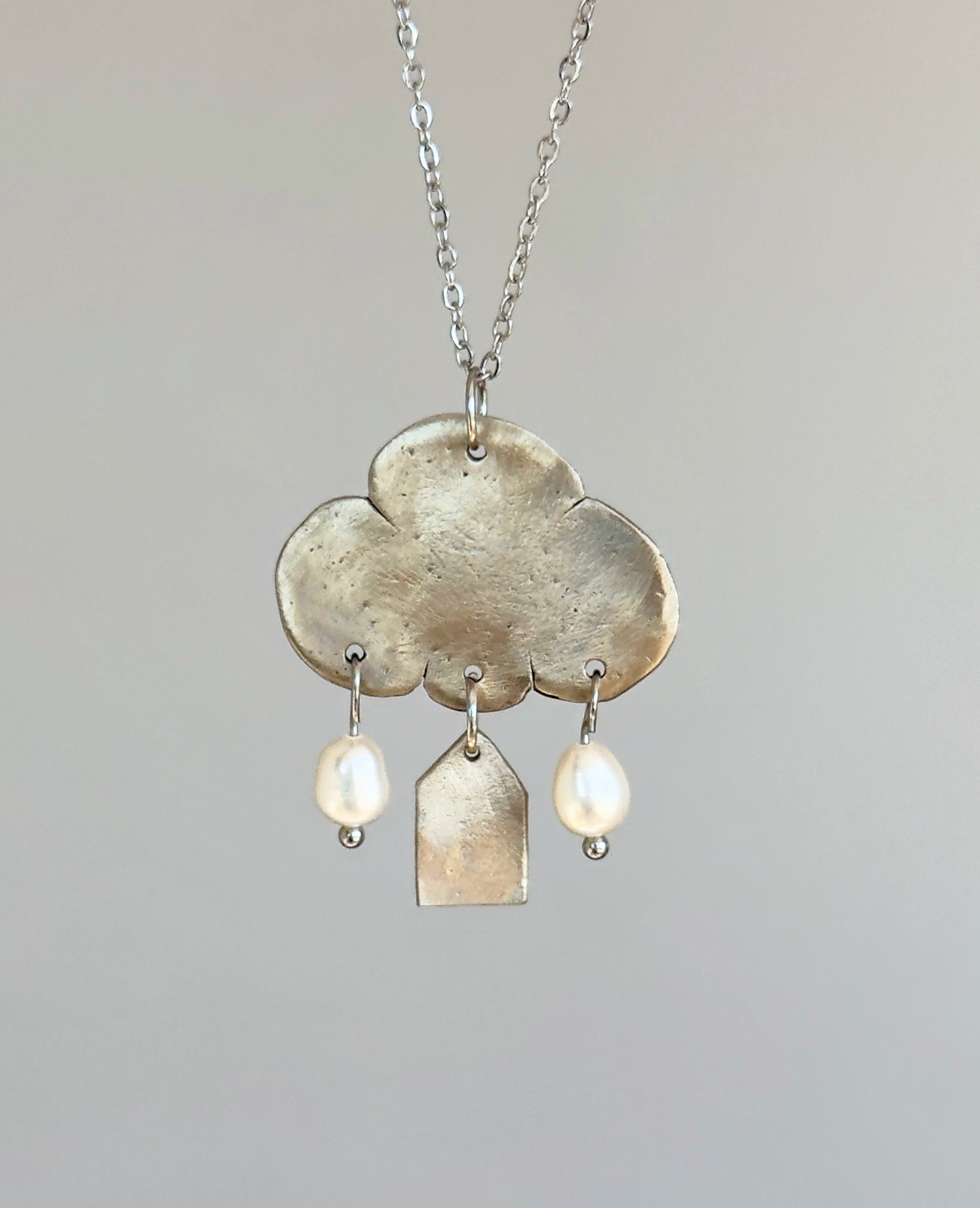 Colgante de bronce blanco «Reflexiones sobre el hogar»