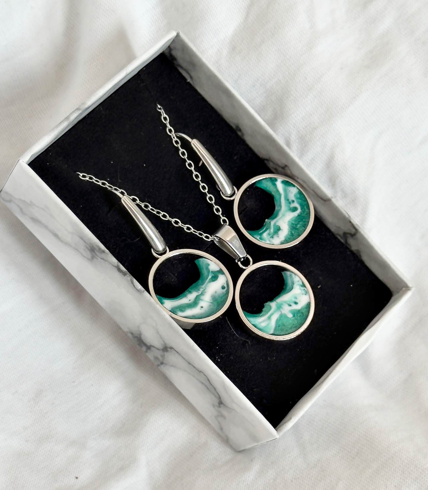Pendientes y colgante de acero inoxidable con olas