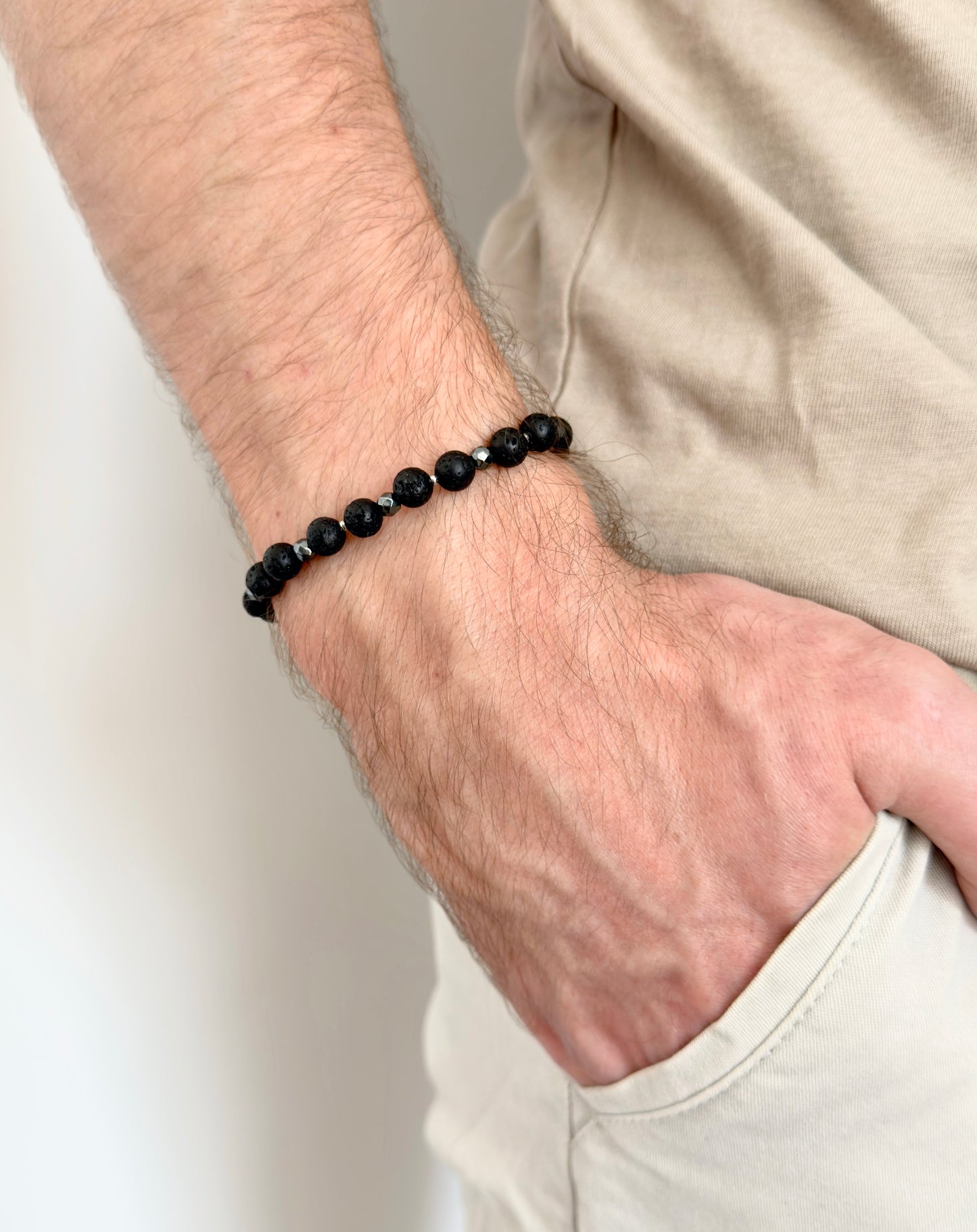 Unisex macrame bracelet with hematite and lava stone