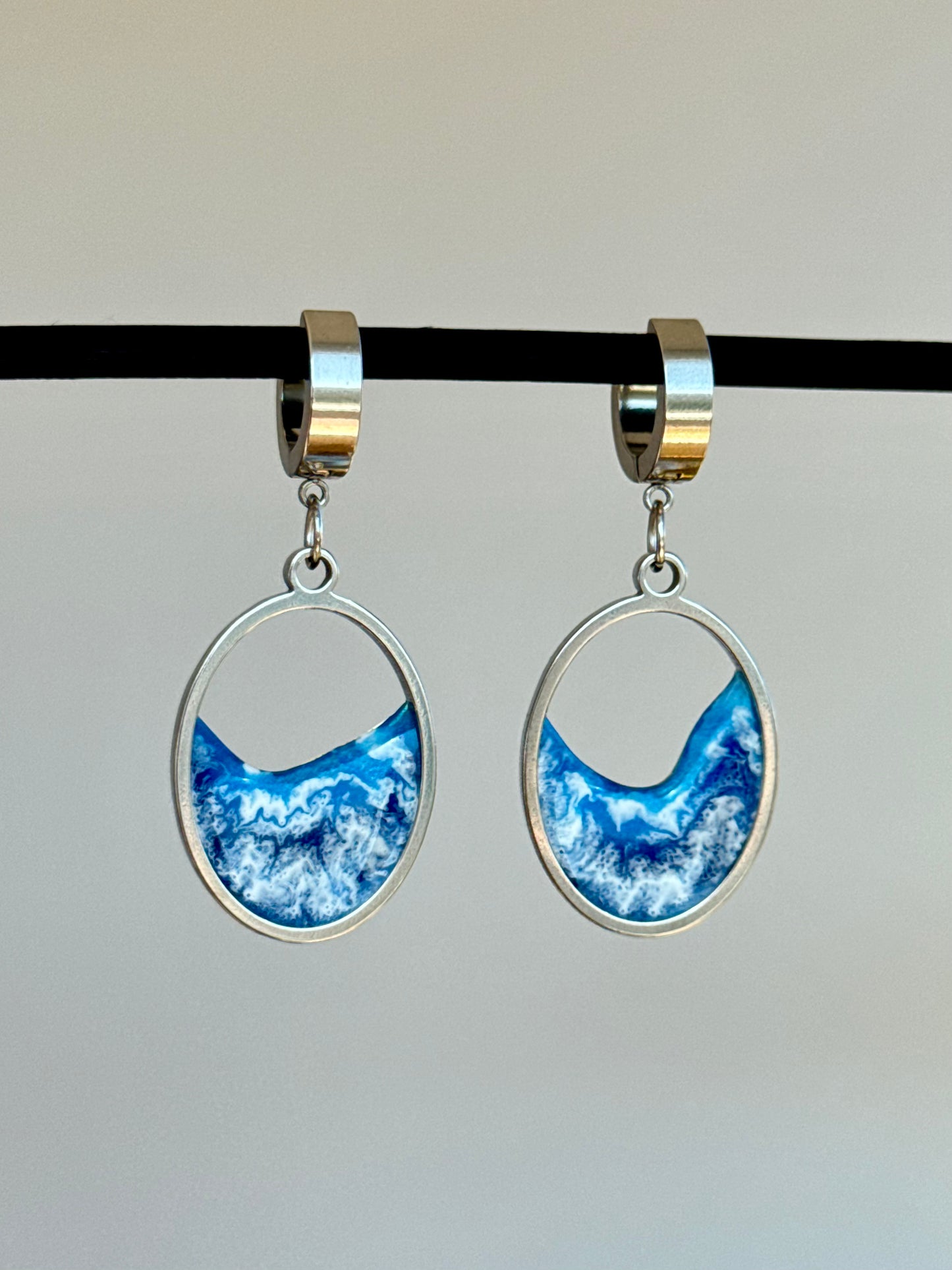 Stainless steel dangle earrings with waves