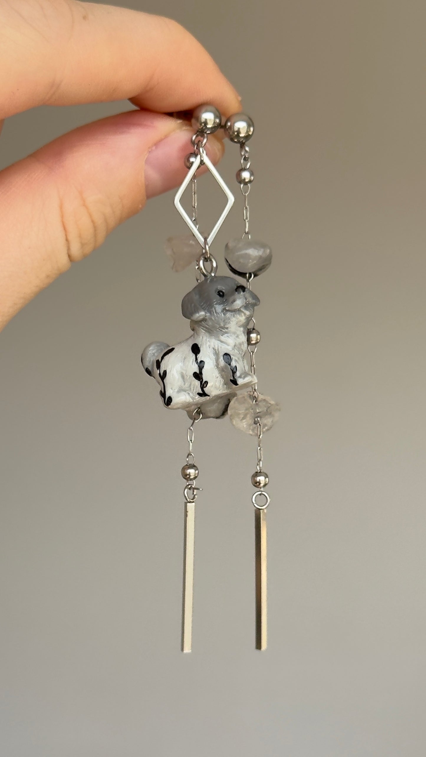 Long asymmetrical gray stainless steel earrings, with a puppy and quartz stones