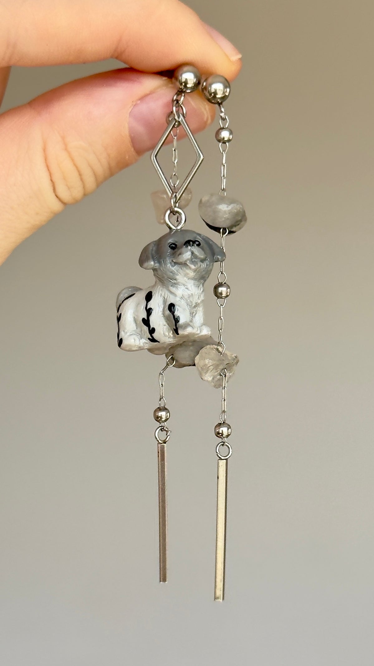 Long asymmetrical gray stainless steel earrings, with a puppy and quartz stones
