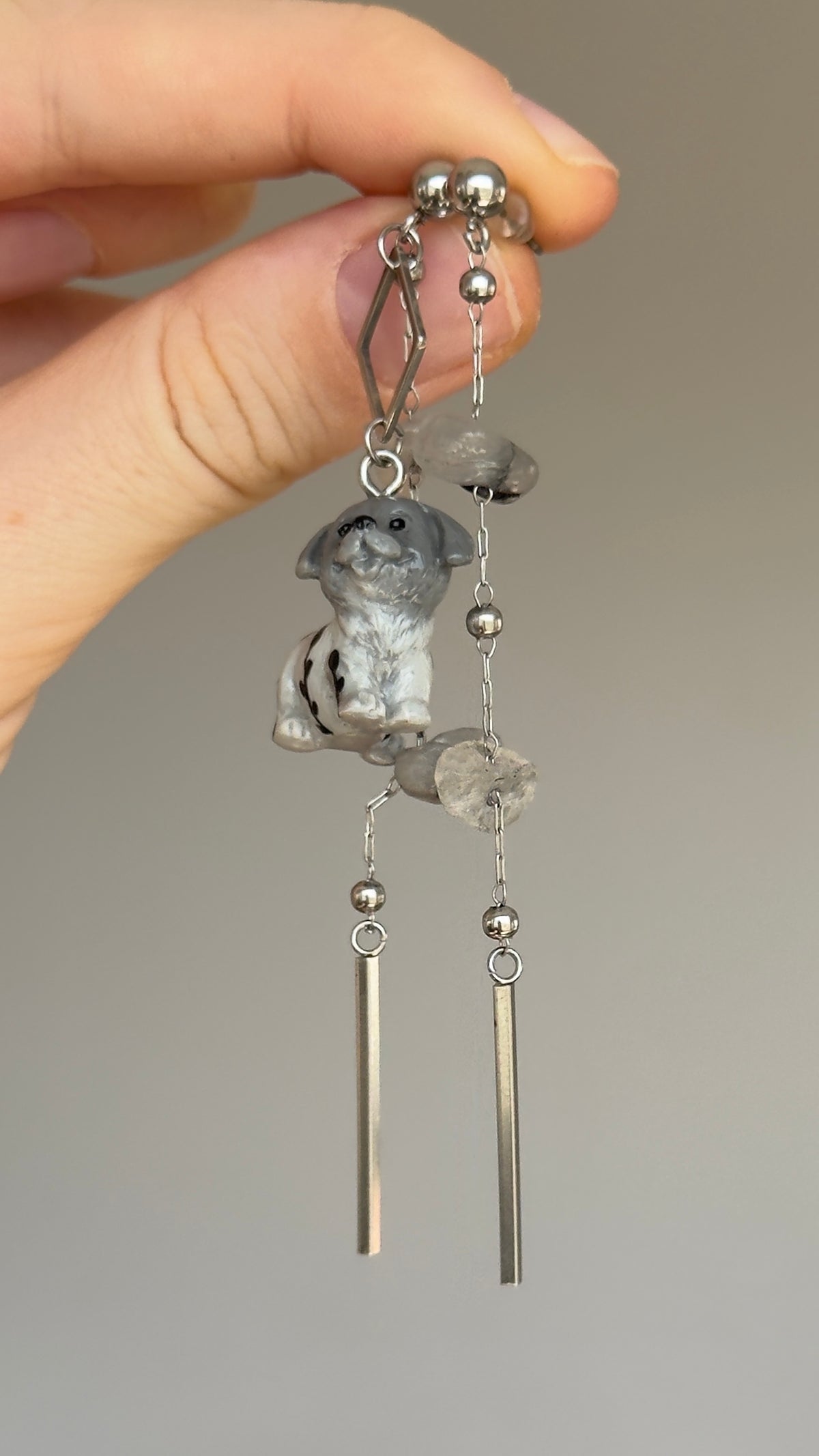 Long asymmetrical gray stainless steel earrings, with a puppy and quartz stones