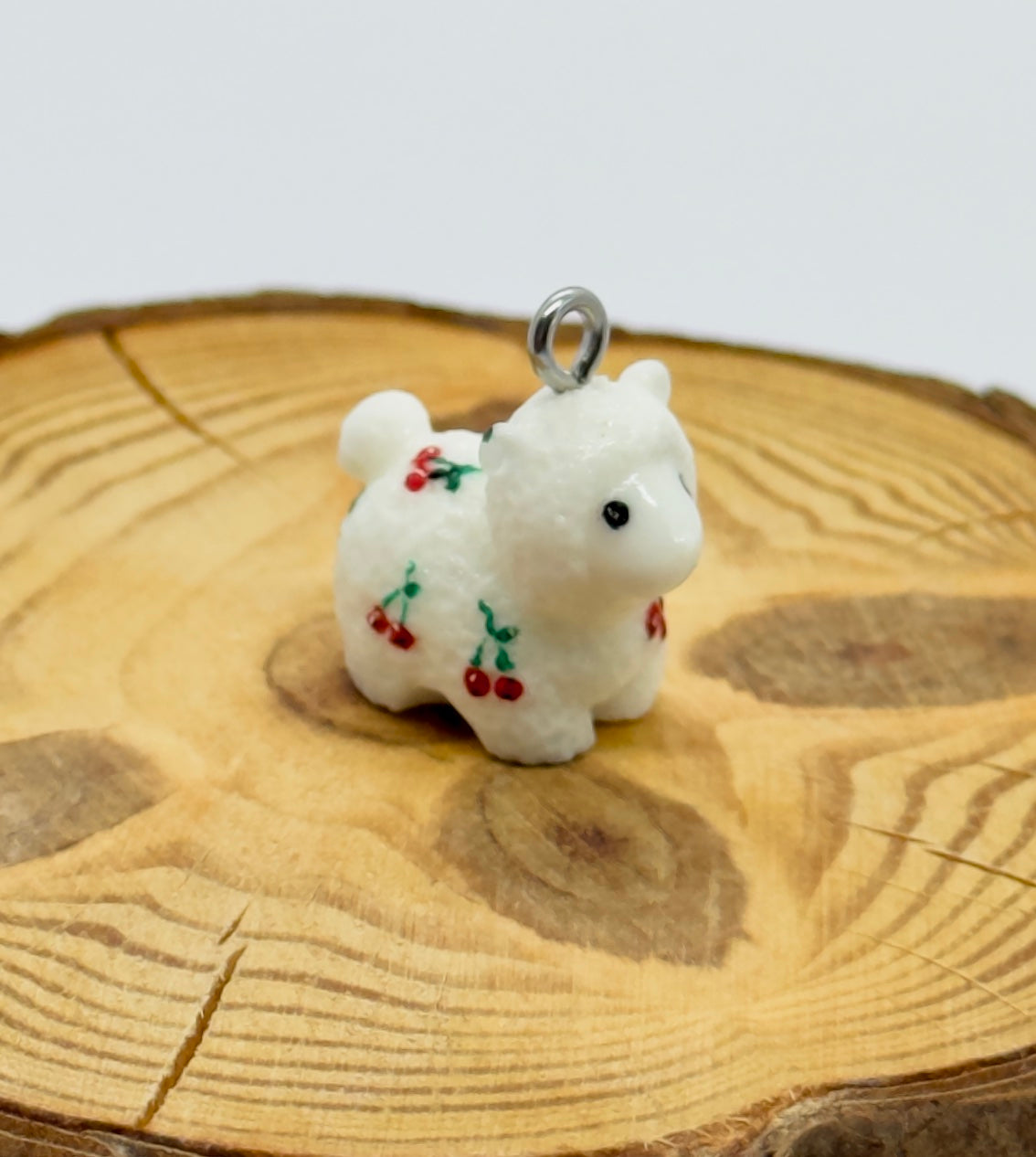 All pendants feature a miniature sheep animal and are hand-painted.
