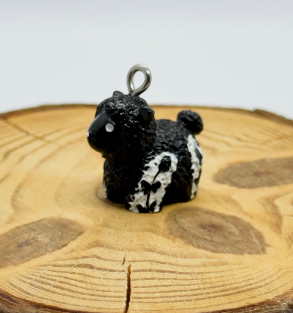All pendants feature a miniature sheep animal and are hand-painted.