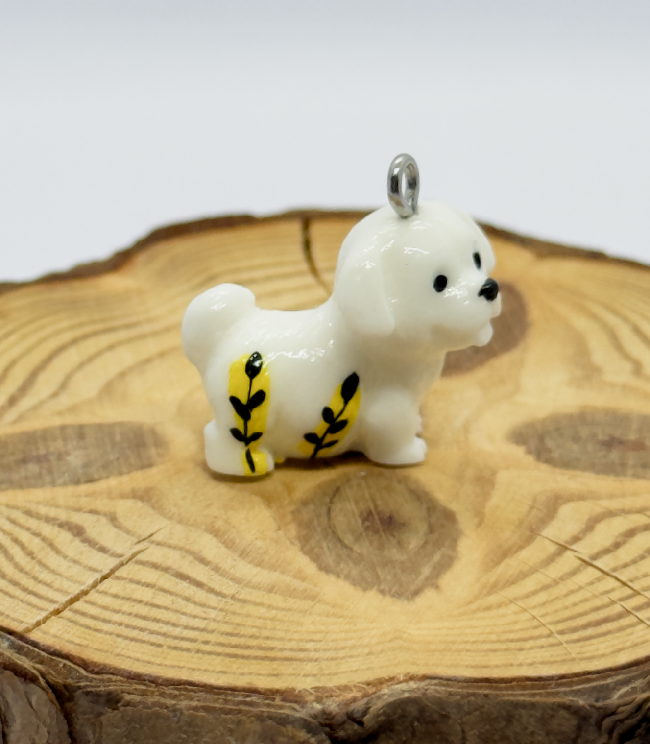All pendants feature a miniature dog and hand-painted details.