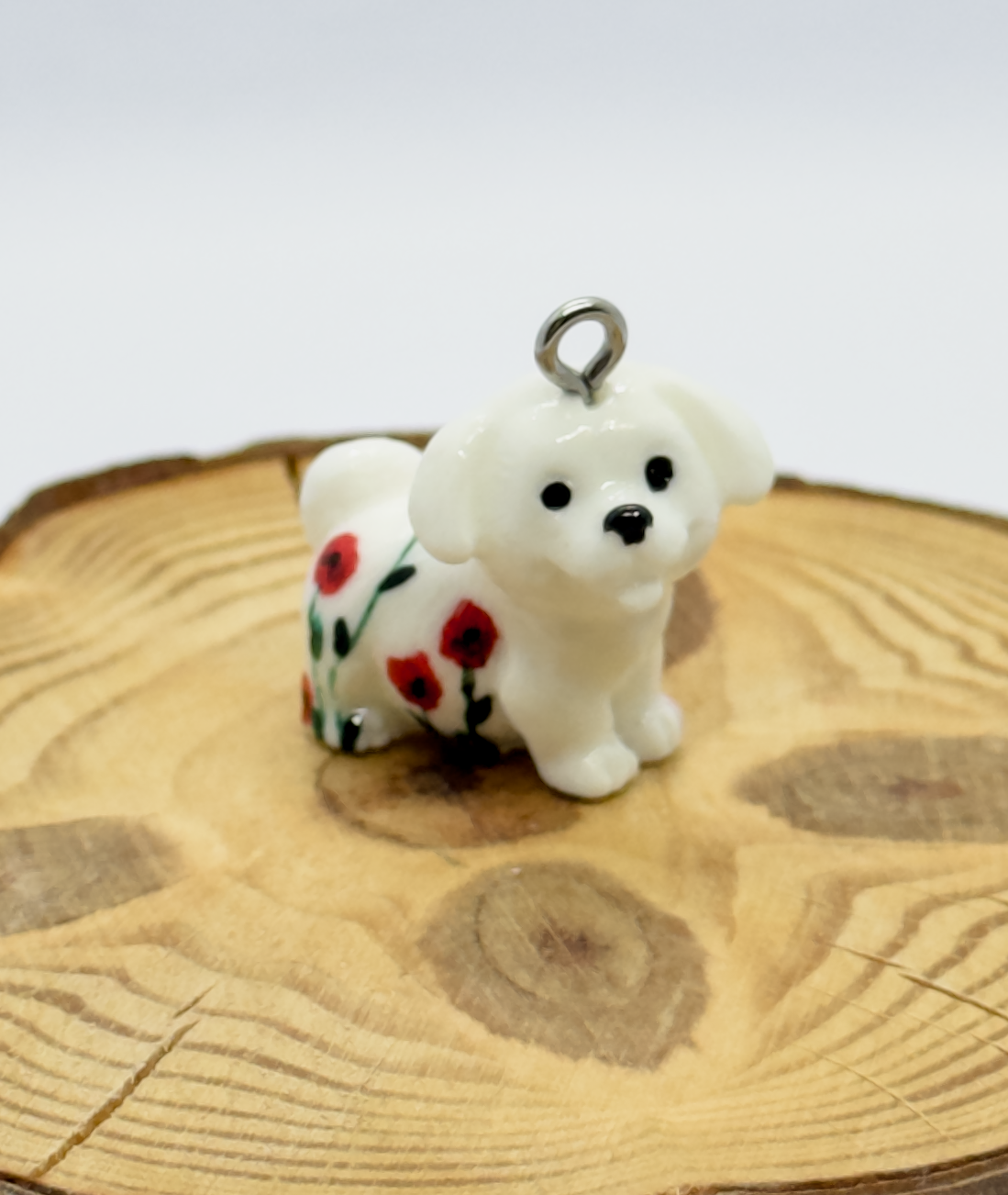 All pendants feature a miniature dog and hand-painted details.