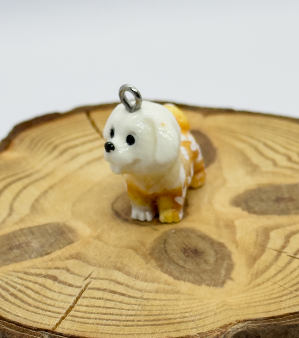 All pendants feature a miniature dog and hand-painted details.
