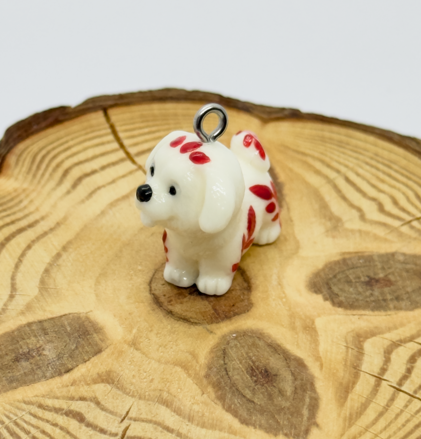 All pendants feature a miniature dog and hand-painted details.