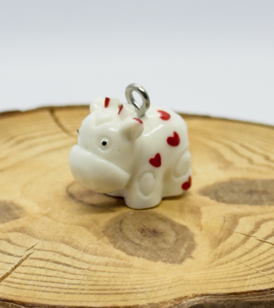 All pendants feature a miniature cow and are hand-painted.