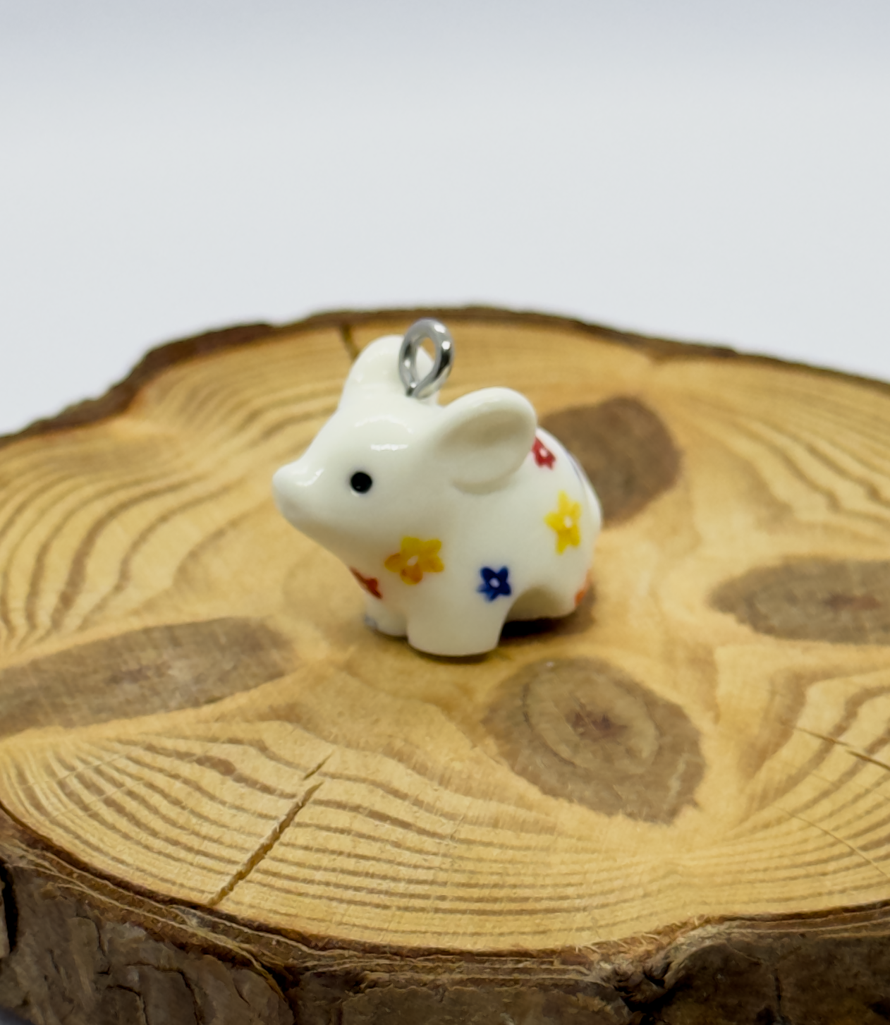 All the pendants feature a miniature piglet animal and are hand-painted.