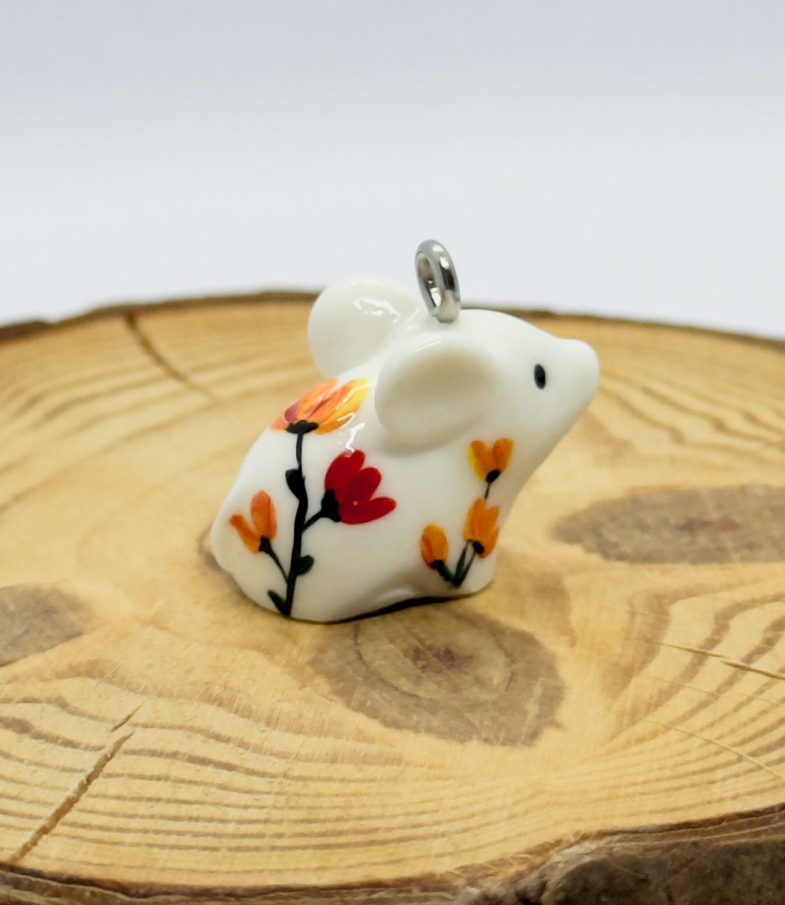 All the pendants feature a miniature piglet animal and are hand-painted.