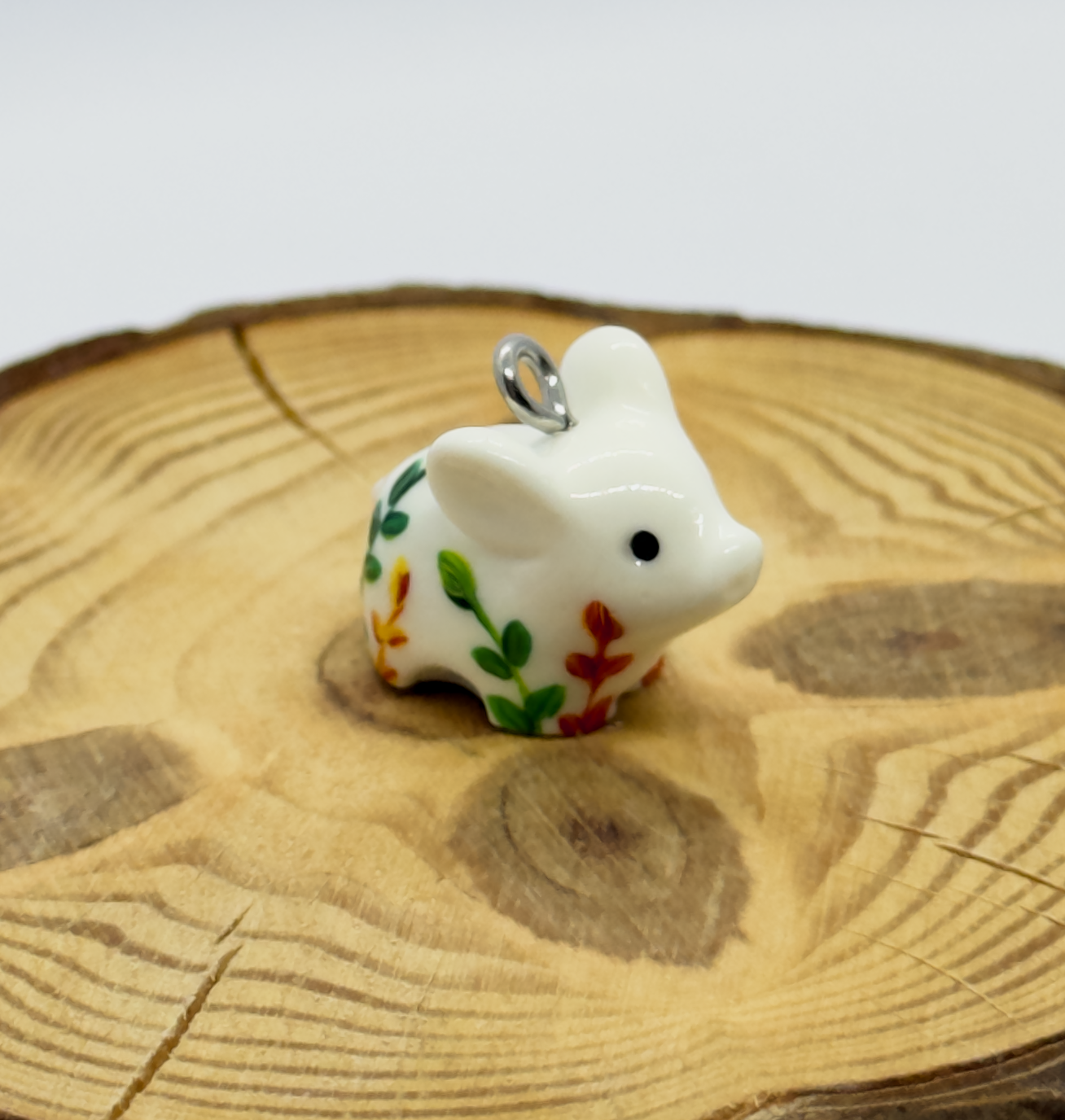 All the pendants feature a miniature piglet animal and are hand-painted.