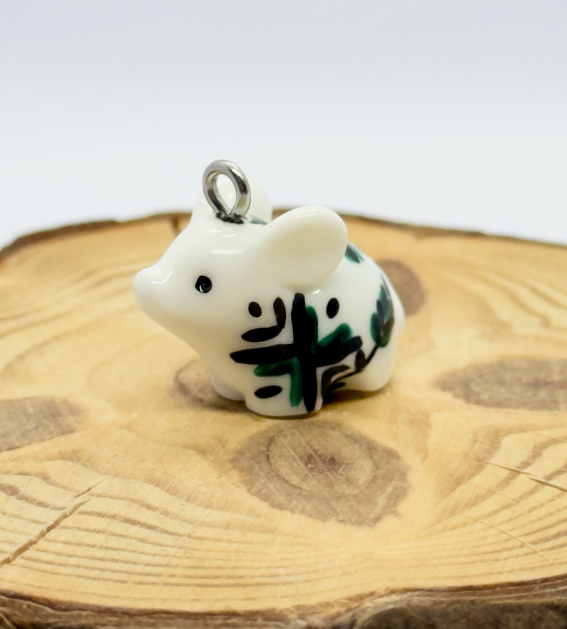 All the pendants feature a miniature piglet animal and are hand-painted.
