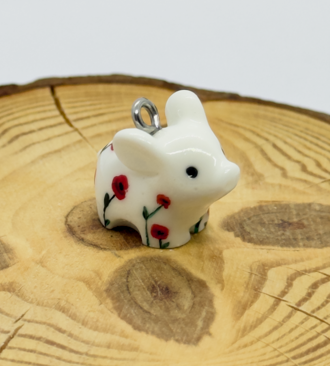 All the pendants feature a miniature piglet animal and are hand-painted.