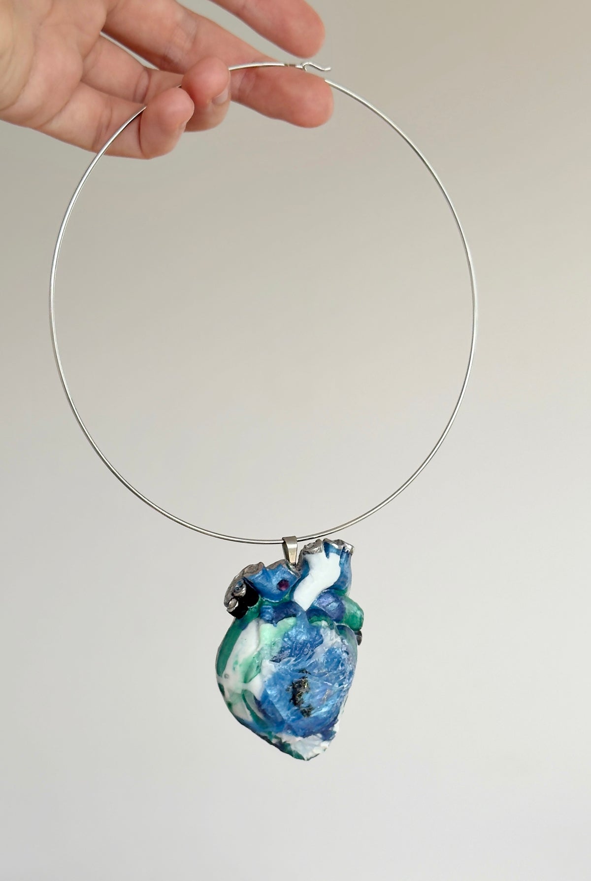 Large anatomical heart-shaped pendant, solid blue pendant