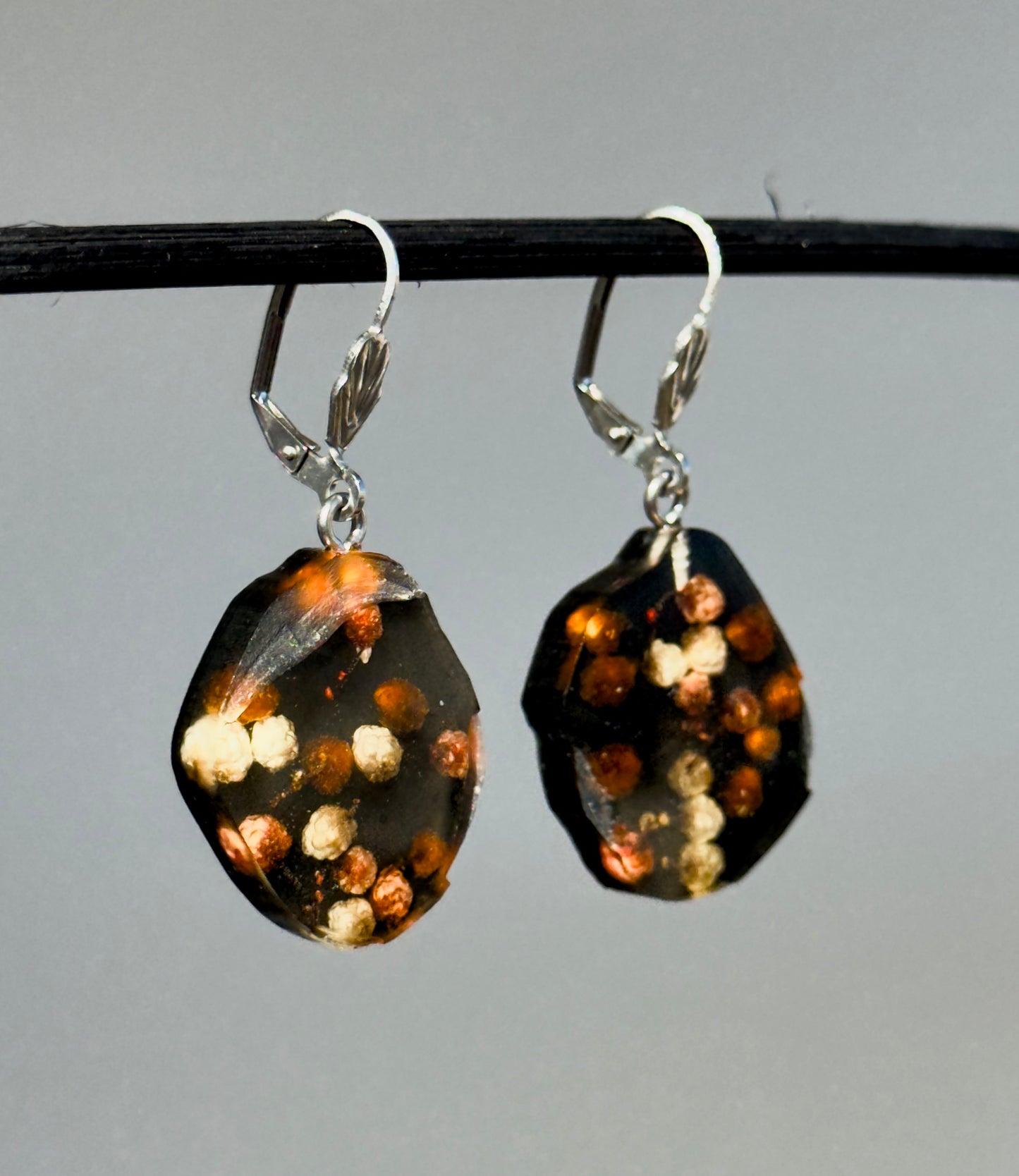 Black earrings with real flowers 