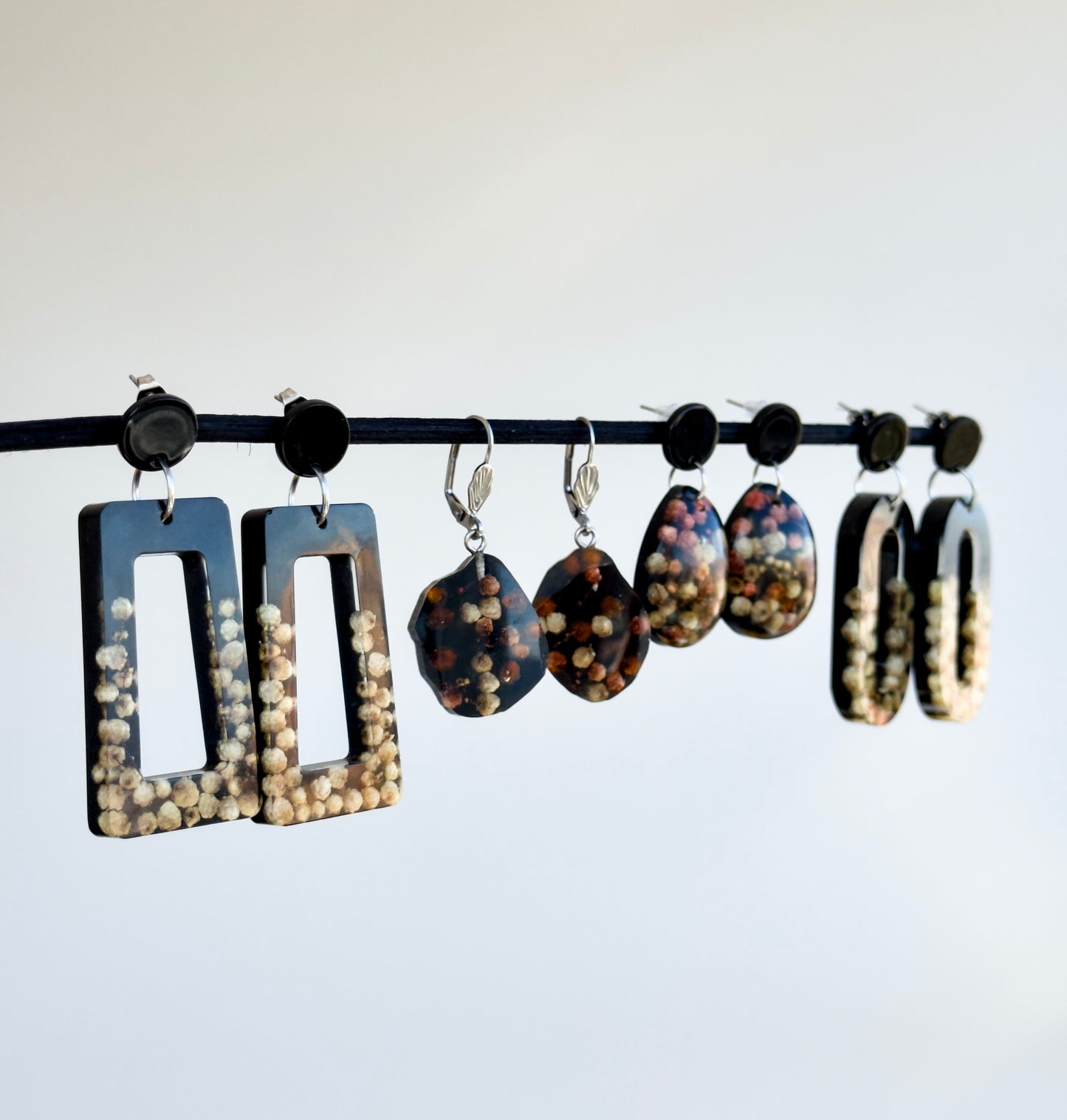 Black earrings with real flowers 