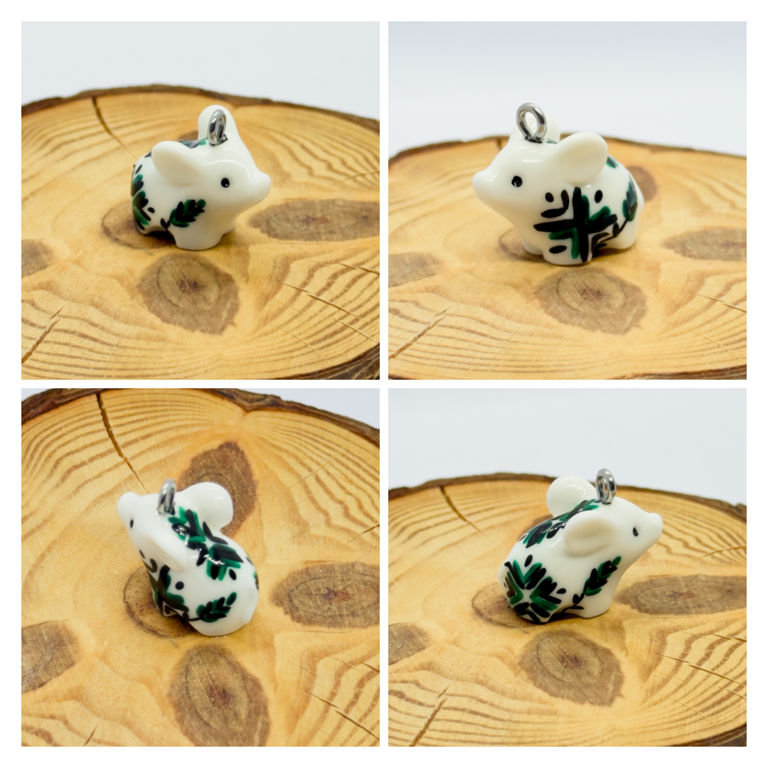 All the pendants feature a miniature piglet animal and are hand-painted.