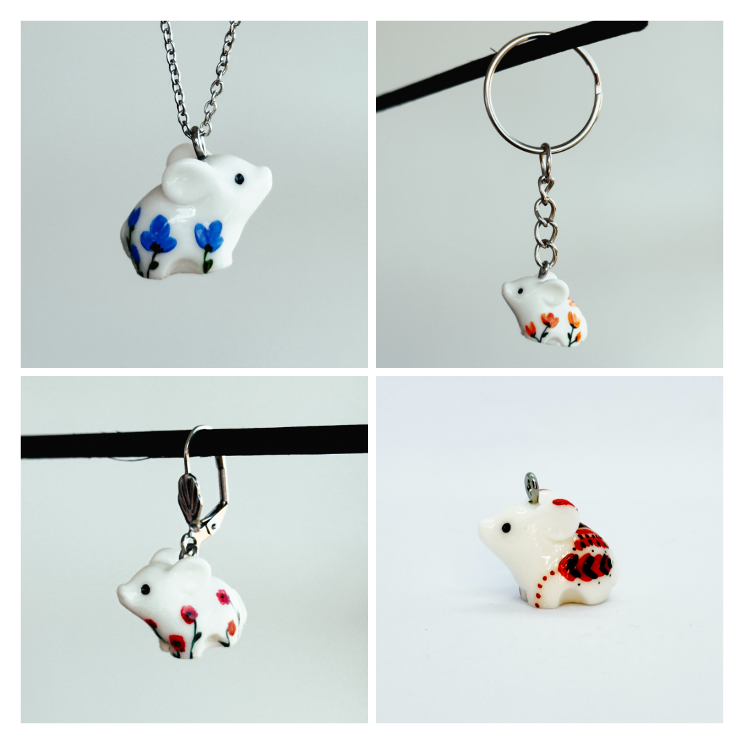 All the pendants feature a miniature piglet animal and are hand-painted.