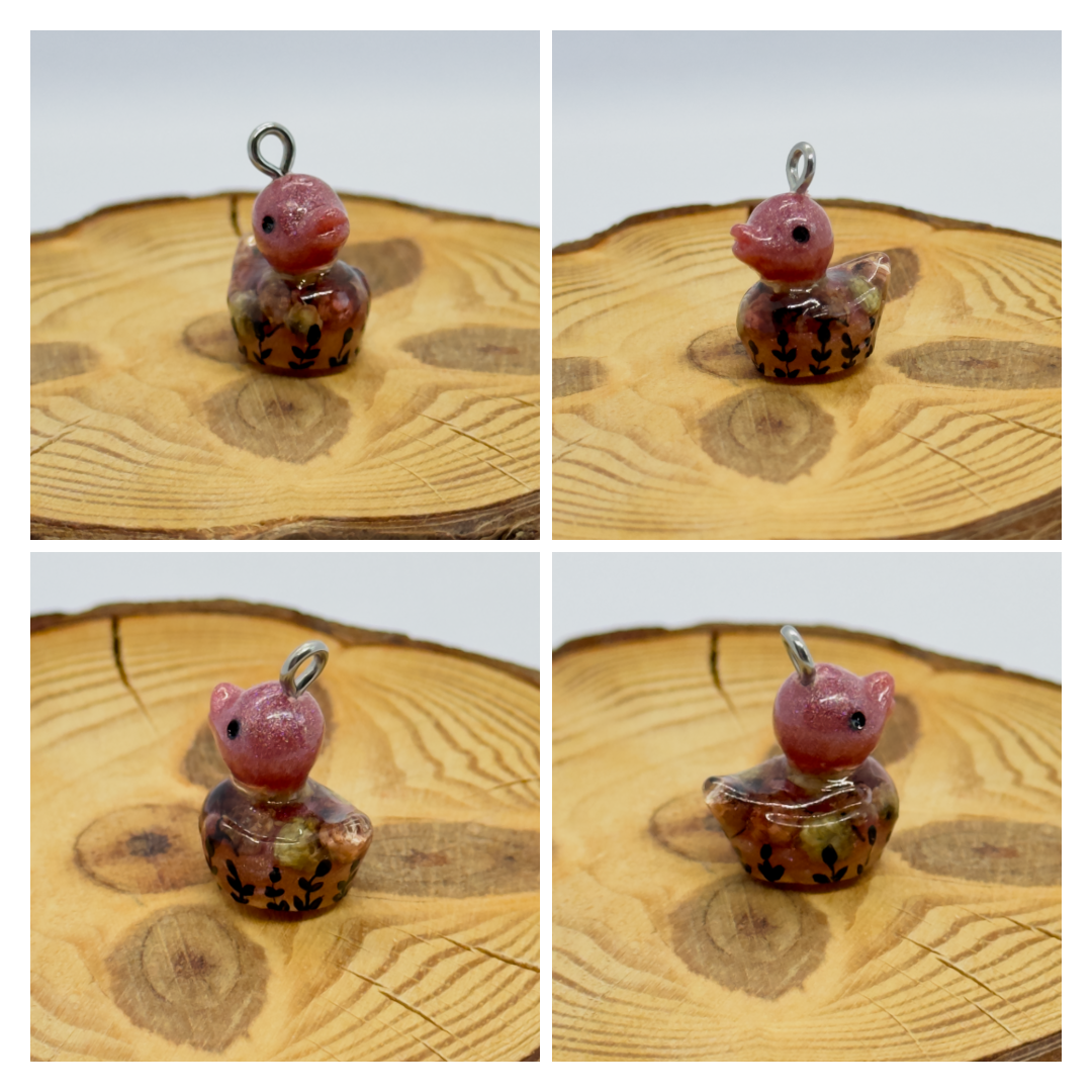 All pendants feature a miniature duck animal and hand-painted details.