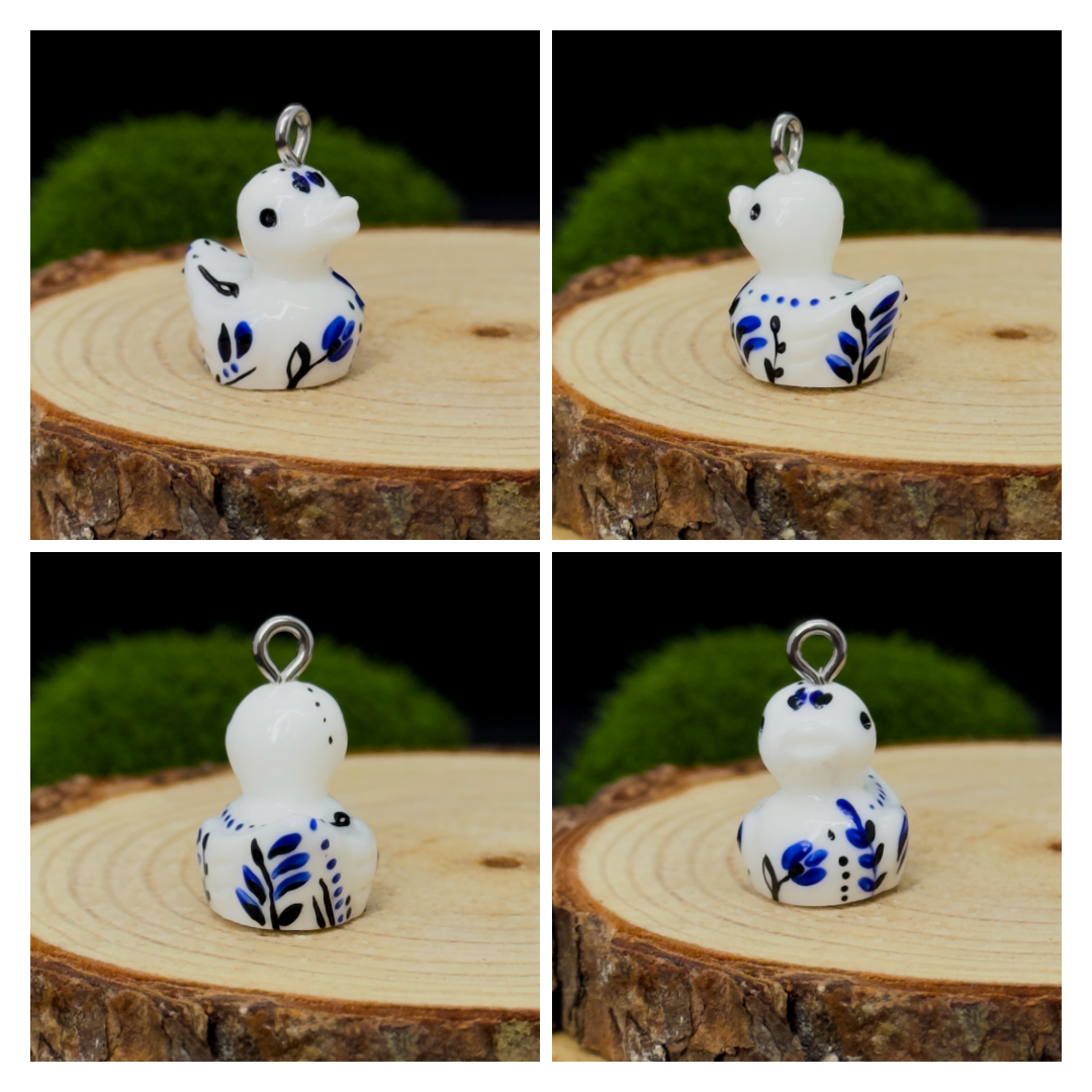All pendants feature a miniature duck animal and hand-painted details.