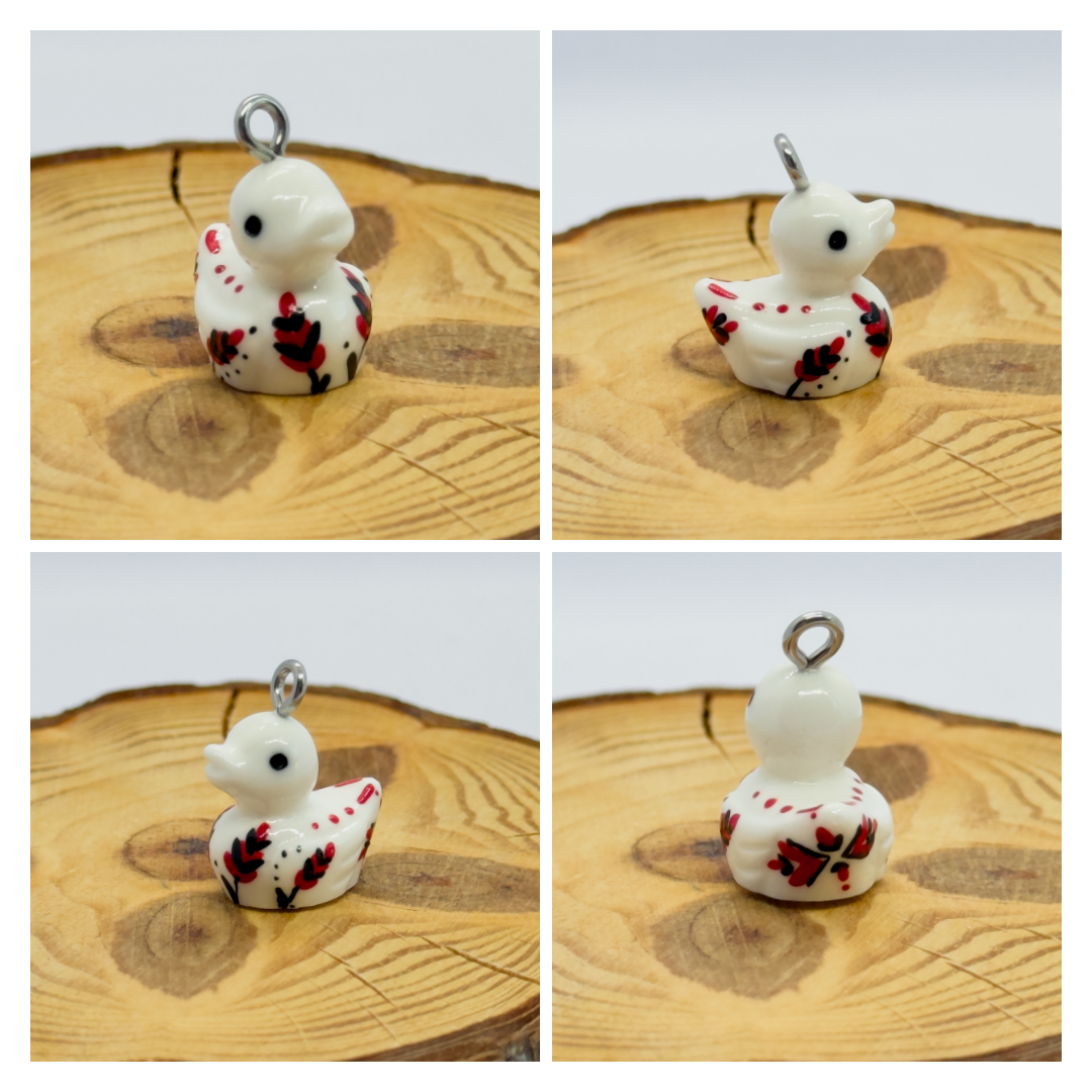 All pendants feature a miniature duck animal and hand-painted details.