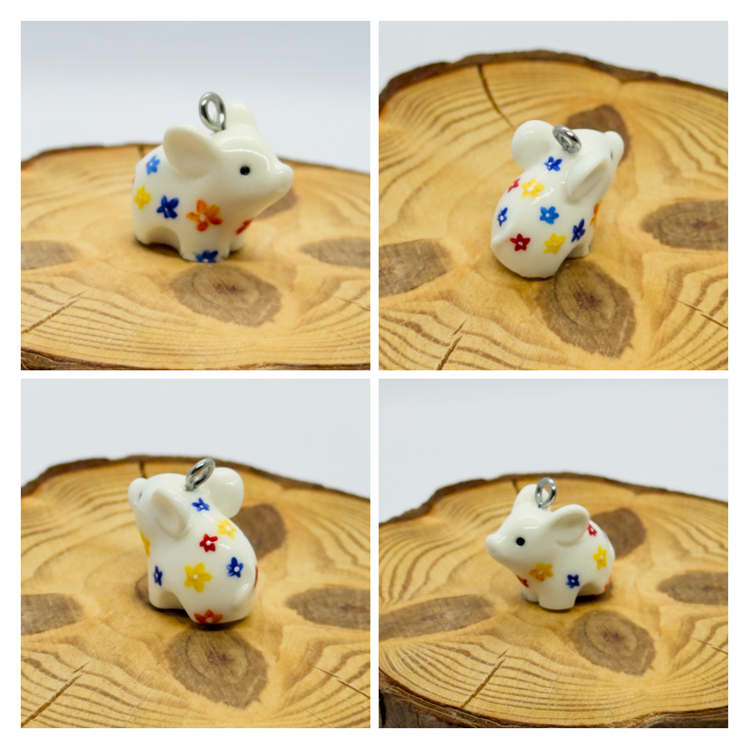 All the pendants feature a miniature piglet animal and are hand-painted.