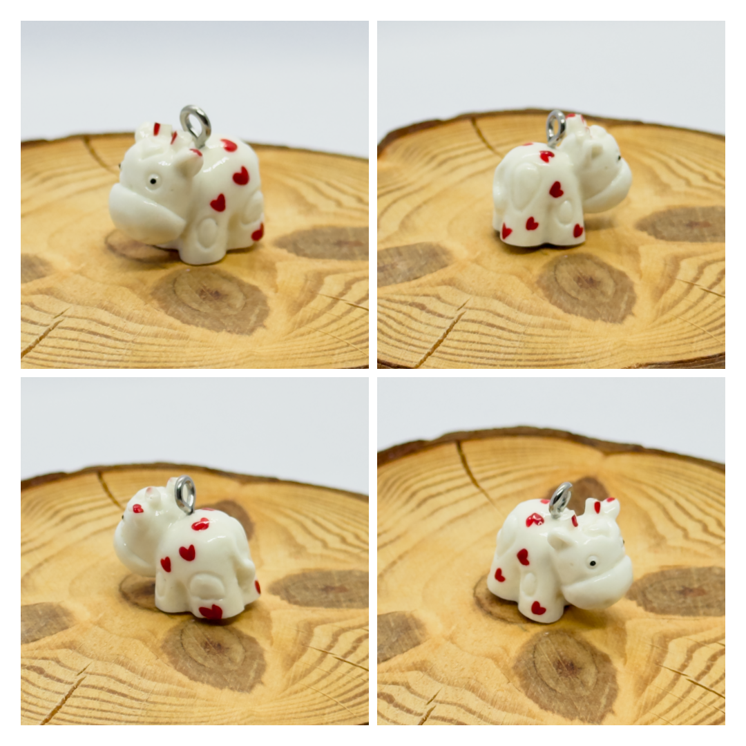 All pendants feature a miniature cow and are hand-painted.
