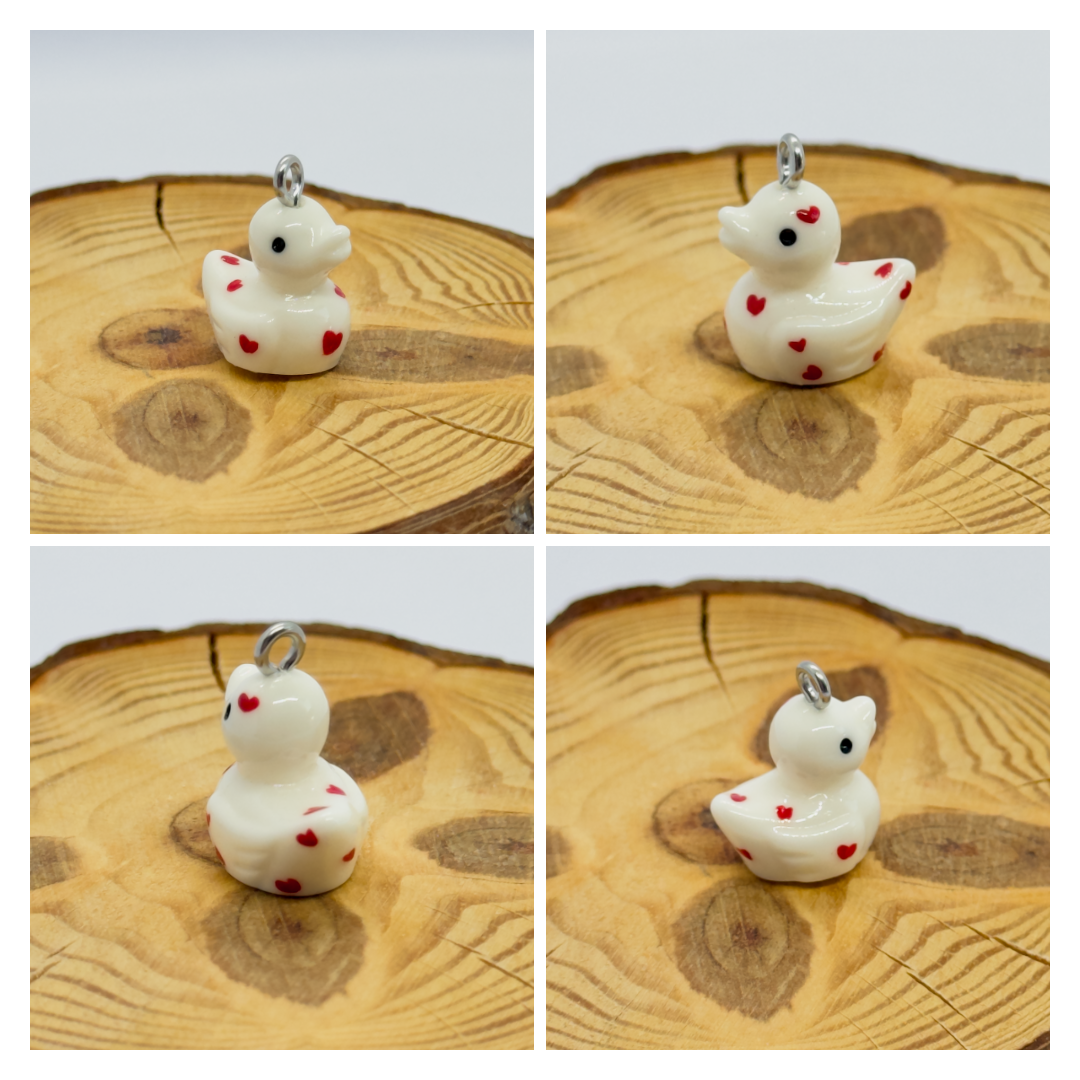All pendants feature a miniature duck animal and hand-painted details.