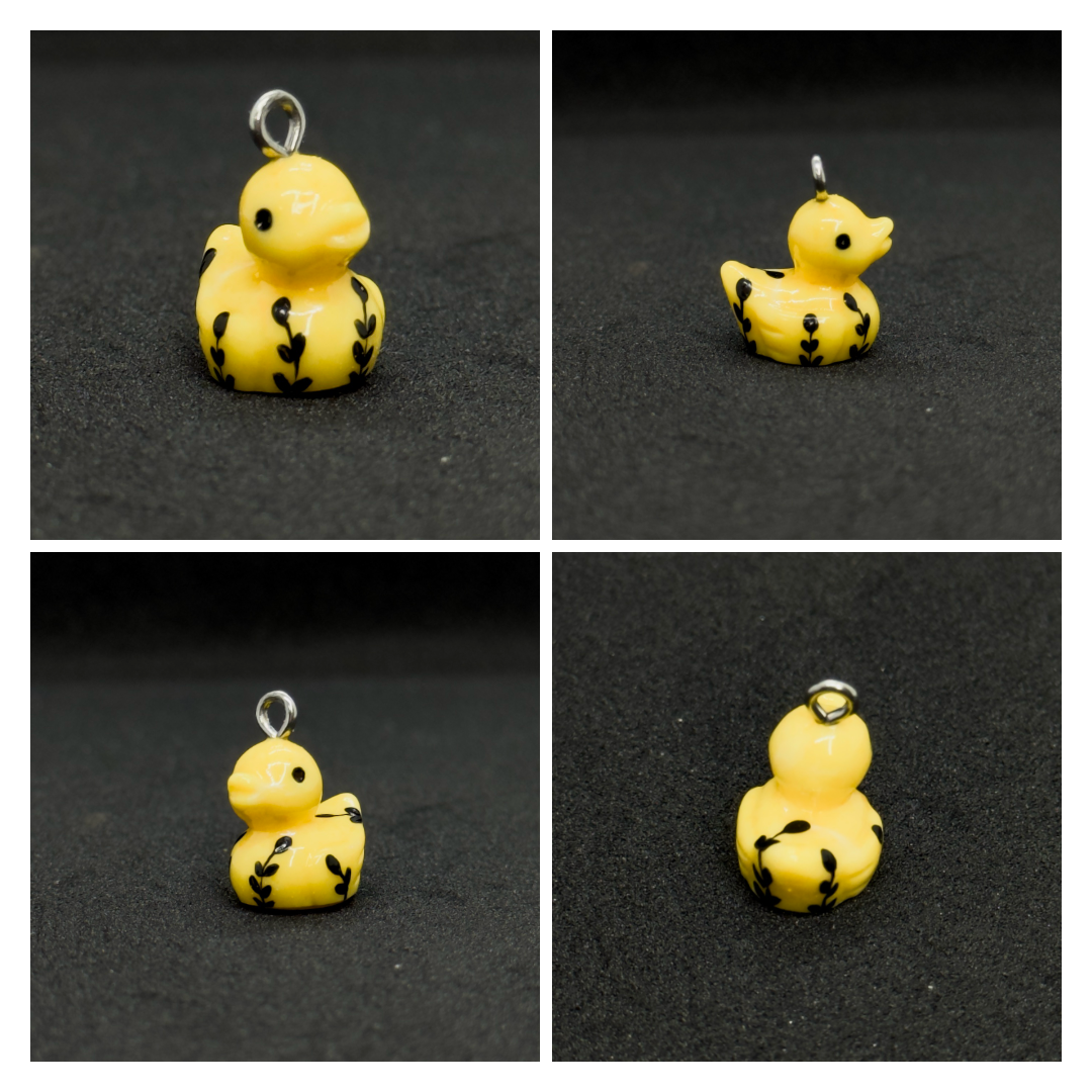 All pendants feature a miniature duck animal and hand-painted details.